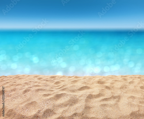 beautiful sandy beach with blur ocean background summer concept © OHishi_Foto