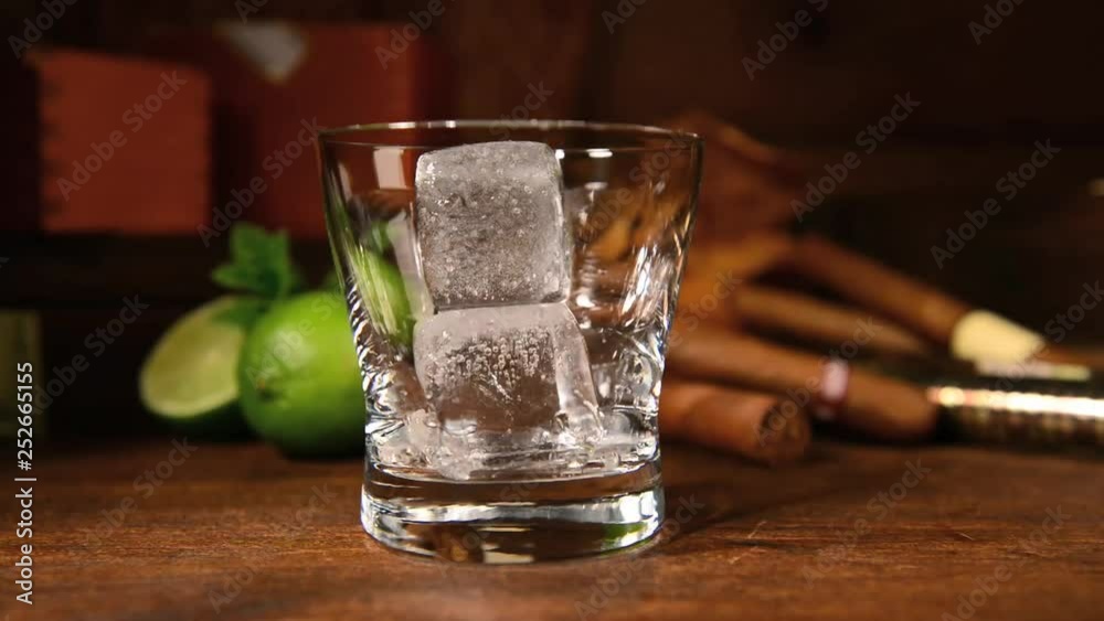 Fill in Rum or Whiky on clear Ice