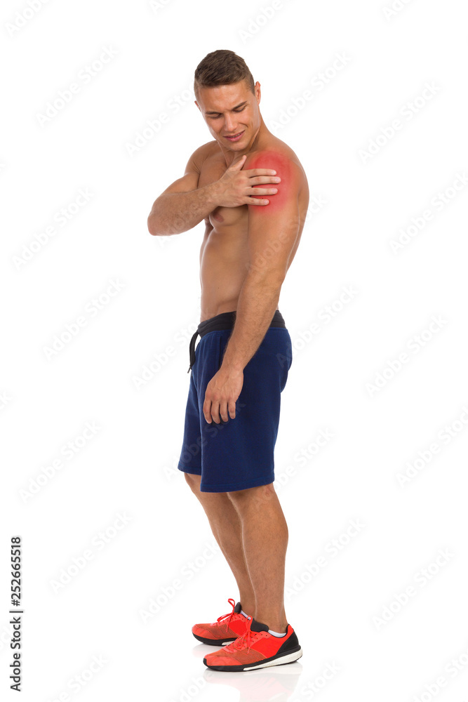 Fototapeta premium Man Holds Shoulder And Suffers