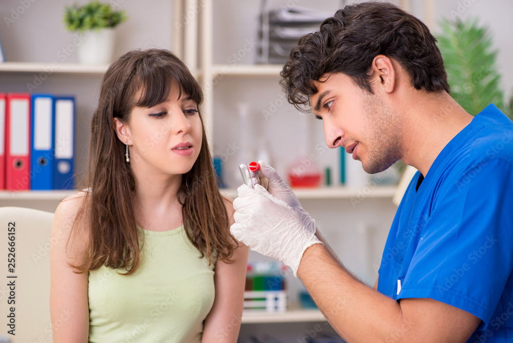 Doctor getting saliva test sample in clinic hospital Doctor getting saliva test sample in clinic hospital