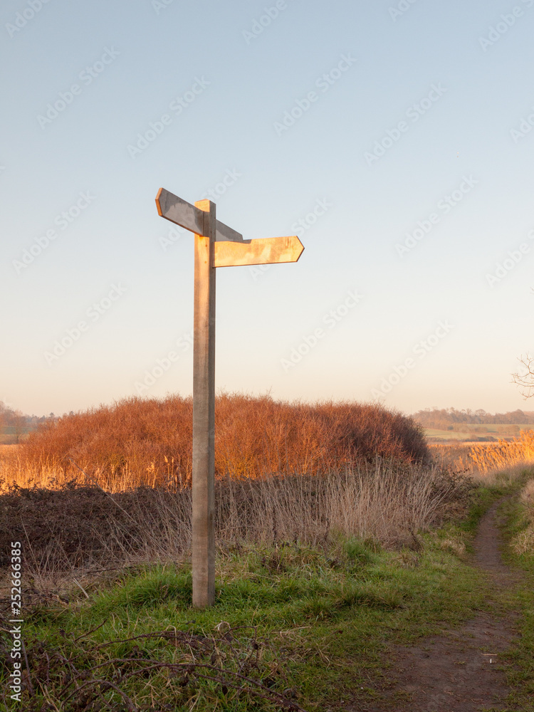 wooden countryside walking way sign directions nature