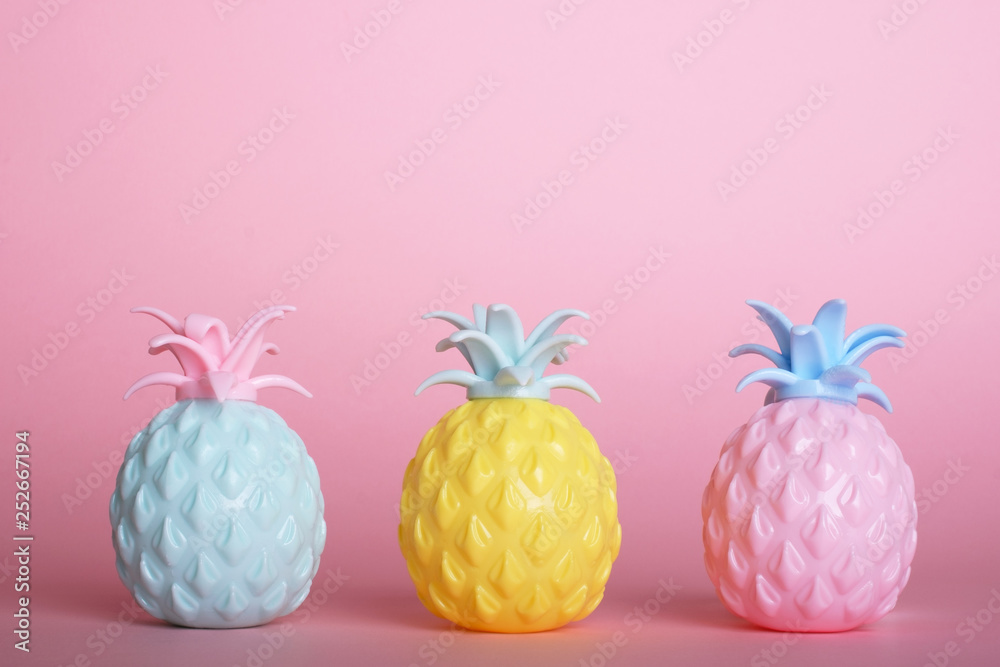 Three pineapples on a pink background and space for your advertising or promotional text.