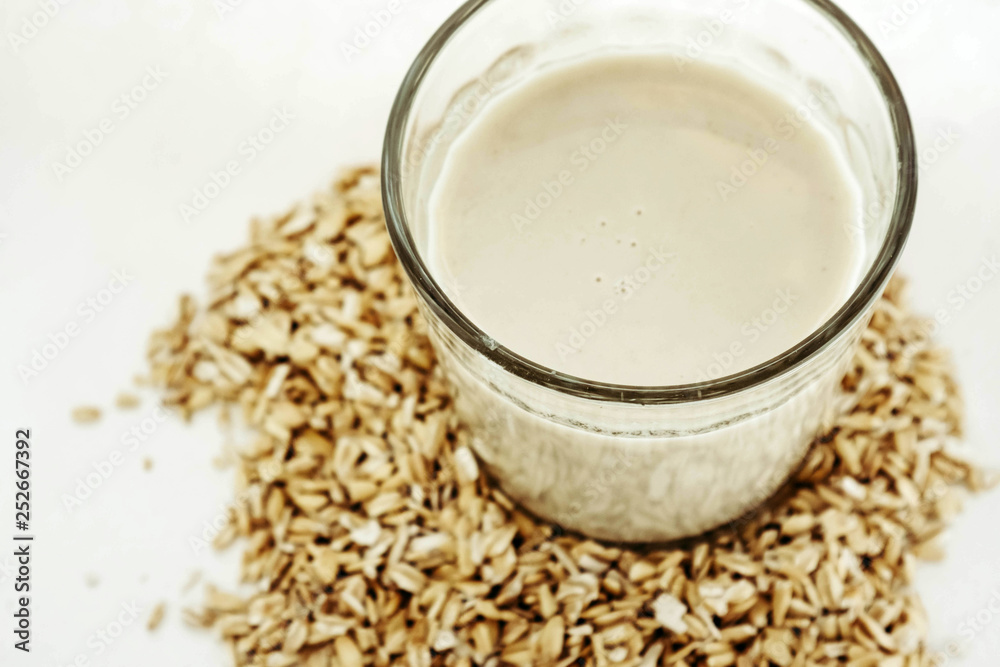 Plant milk. Oat grains milk on white background. Healthy food Plant milk. Oat grains milk on white background. Healthy food