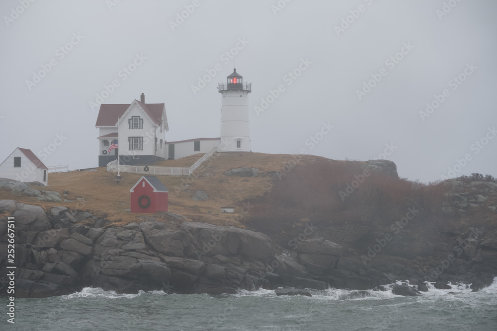 Gale Force winds and large waves at the Cape Neddick Lighthouse on the Maine Coast during a December Storm