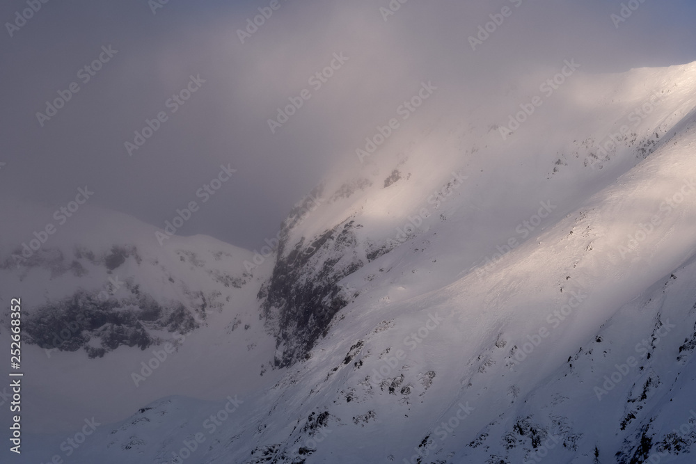 Mountain peaks with snow at sunset Mountain peaks with snow at sunset