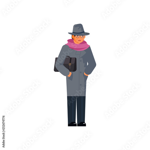 Mysterious man wearing a gray hat and coat 