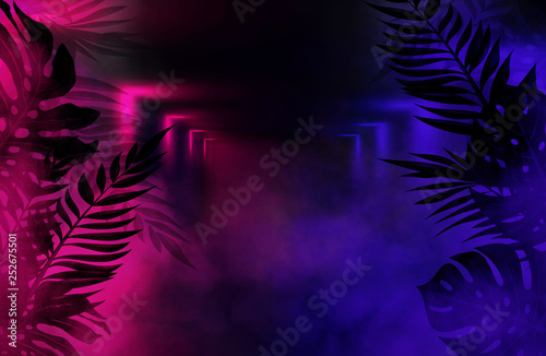 Background of an empty room with brick walls and neon lights. Silhouettes of tropical leaves, colorful smoke photo