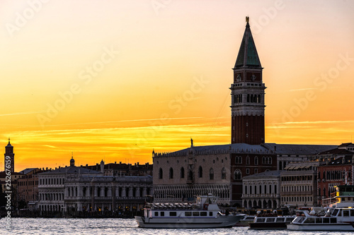 Colorful Venice skyline at sunset with St Mark's Campanile bell tower and the Doges Palace in Venice, Italy.