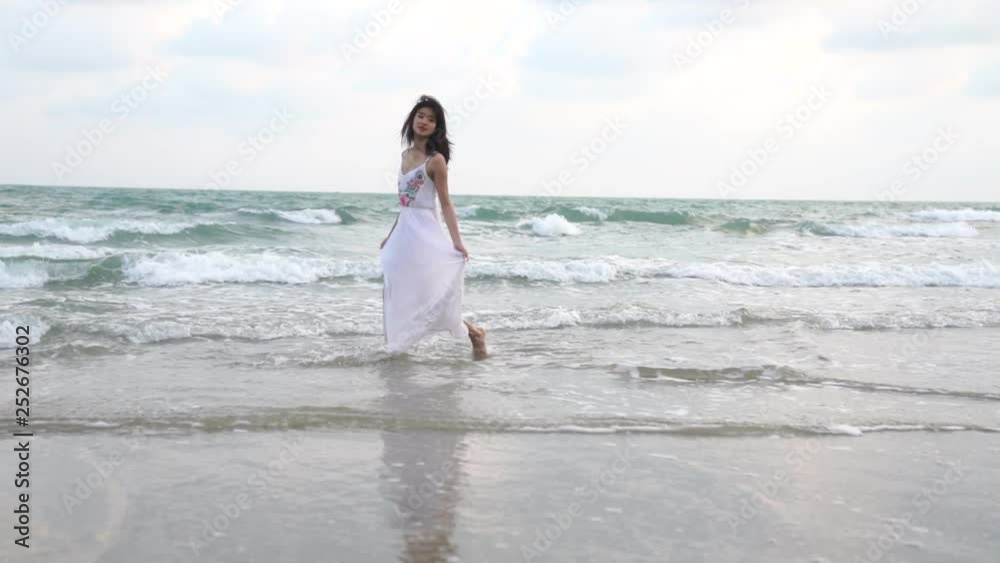 Asian cute girl relax on the beach . Relaxing concept. Asian cute girl relax on the beach . Relaxing concept.