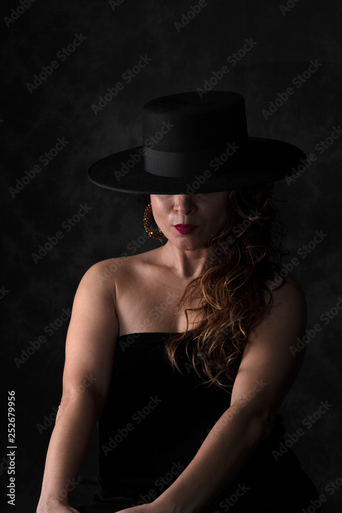 girl with black spanish hat
