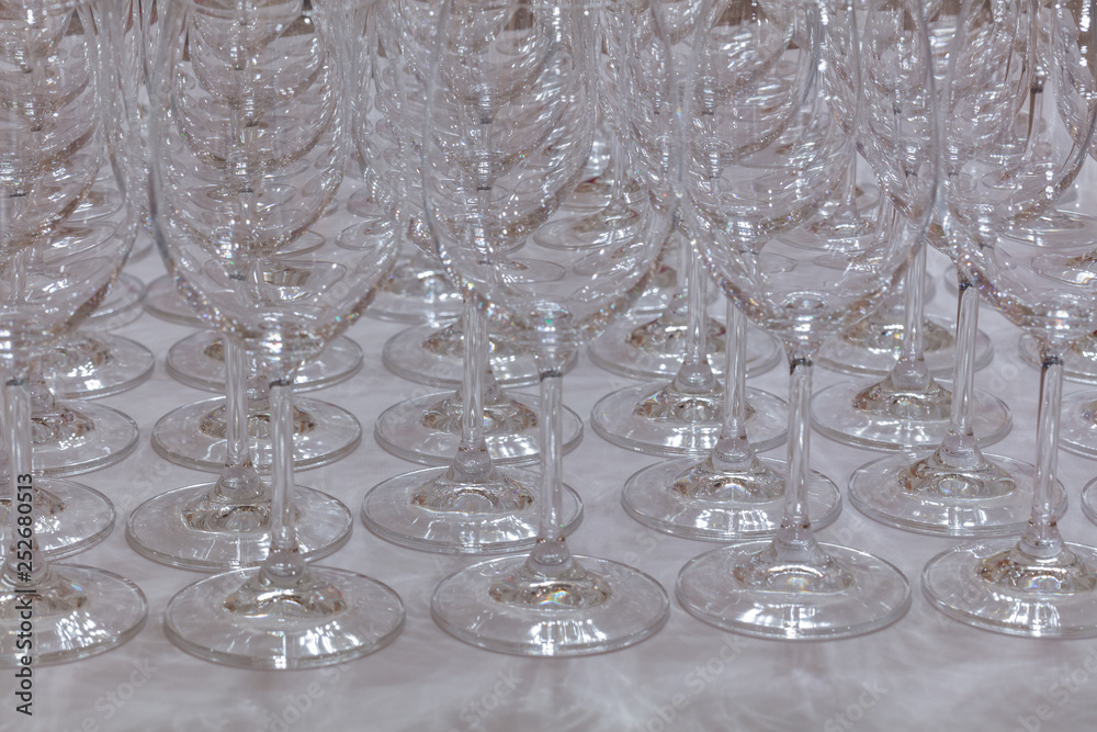 closeup of wine glasses on buffet table closeup of wine glasses on buffet table