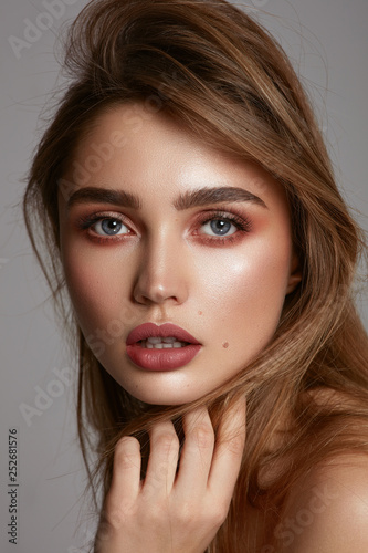 Close-up face of young pretty girl with big eyebrow photo