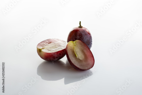 Split red grape isolated