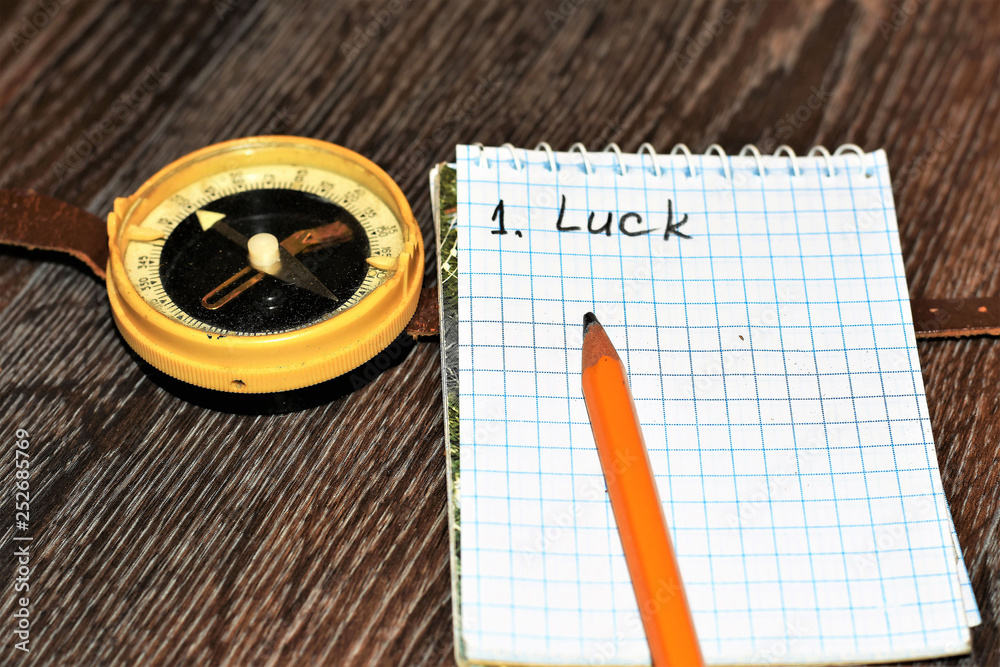 Compass, notebook and pencil on the table Compass, notebook and pencil on the table