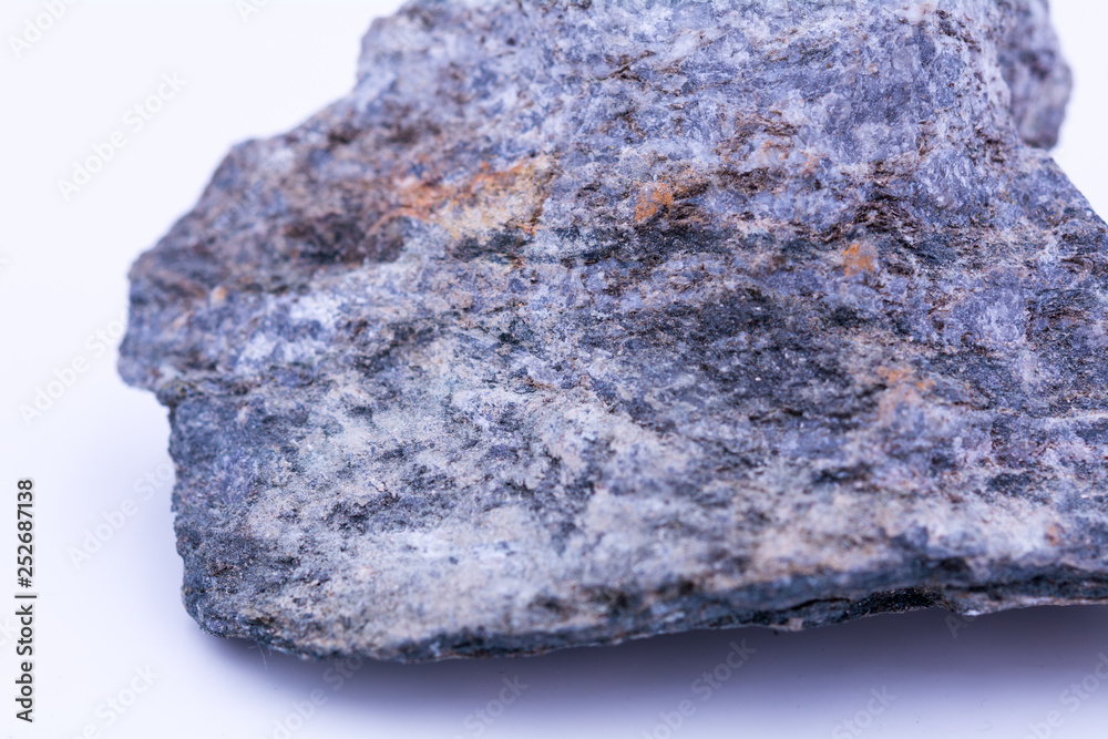Fototapeta premium A natural stone with blue shades, dust, rust and dirt on the surface, macro, close up