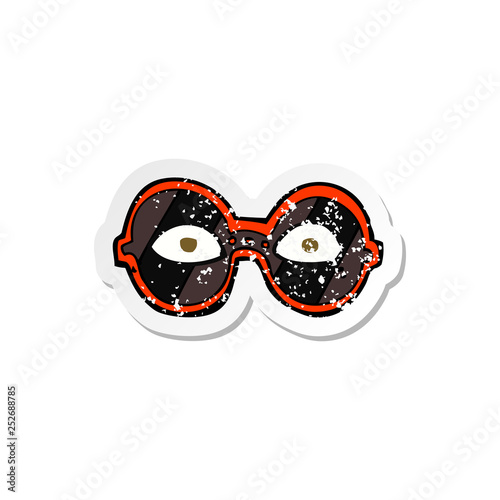 retro distressed sticker of a cartoon eyes in dark glasses