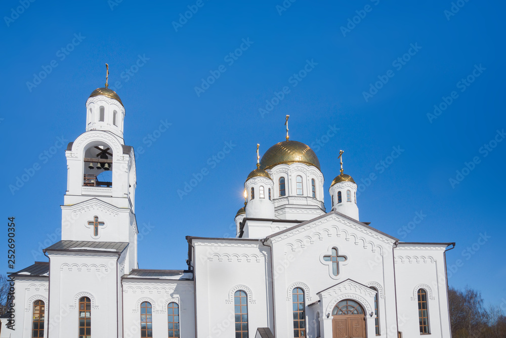 Eastern orthodox crosses on gold domes (cupolas) againts blue sky - Church, Khimki, Russia
