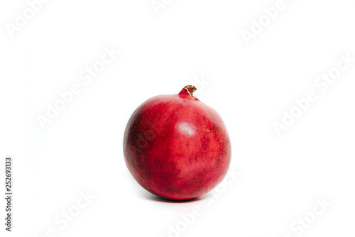 Fresh fruit pomegranate isolated on white. Red pomegranate fruit, tropical fruit. Pomegranate on white background. Eating exotic fruits, calories and vitamins. Sweet fruits to eat.