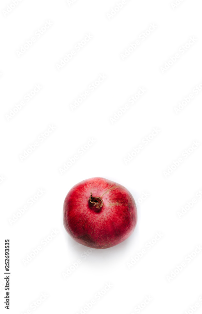 Top view of Fresh fruit pomegranate isolated on white. Red pomegranate fruit, tropical fruit. Pomegranate on white. Eating exotic fruits, calories and vitamins. Sweet fruits to eat. Top view of Fresh fruit pomegranate isolated on white. Red pomegranate fruit, tropical fruit. Pomegranate on white. Eating exotic fruits, calories and vitamins. Sweet fruits to eat.