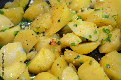 Healthy nutrition of organic baked potato. Healthy vegan food. Healthy vegetarian dinner. Fresh green onions.