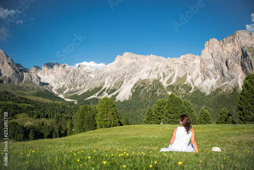 White dressed woman at the Dolomites
