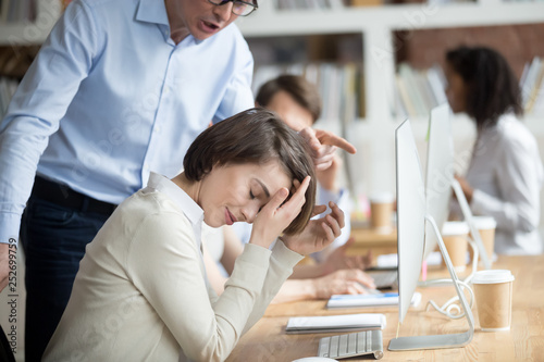 Принти на полотні Angry irritated company ceo reprimanding employee female