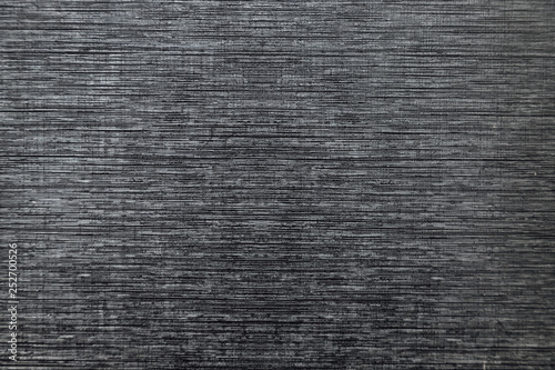 Close-up macro of black plastic striped texture
