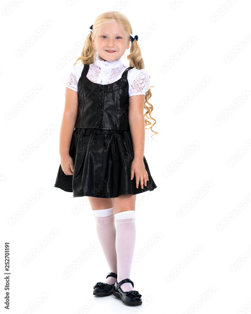 Beautiful little girl in a school uniform. Beautiful little girl in a school uniform.