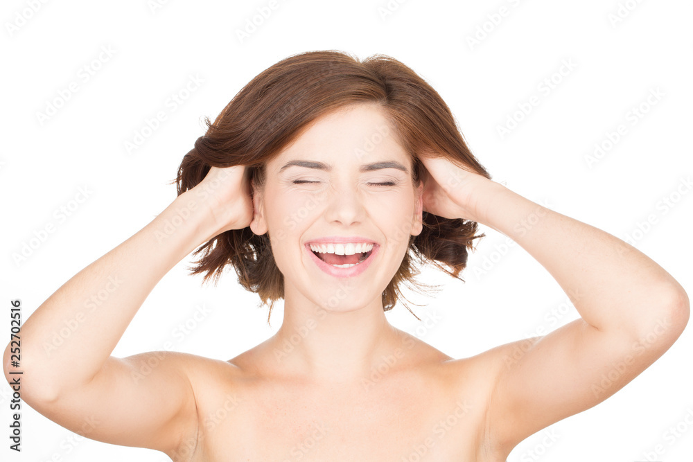 Feel the freshness. Horizontal portrait of a young woman laughing and touching her hair Feel the freshness. Horizontal portrait of a young woman laughing and touching her hair