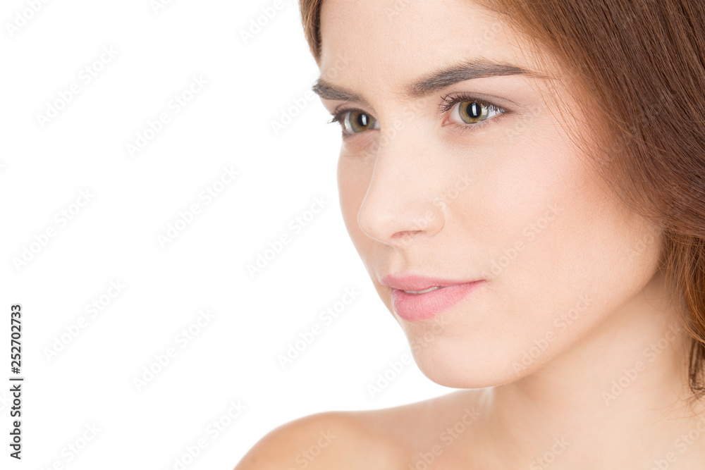 Serious about the skincare. Closeup portrait of a beautiful female looking thoughtfully isolated on white Serious about the skincare. Closeup portrait of a beautiful female looking thoughtfully isolated on white