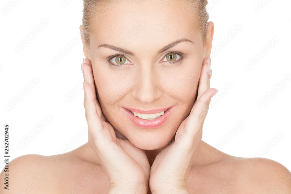 Simply perfect. Horizontal portrait of a beautiful mature woman cupping her face in her hands and smiling confidently