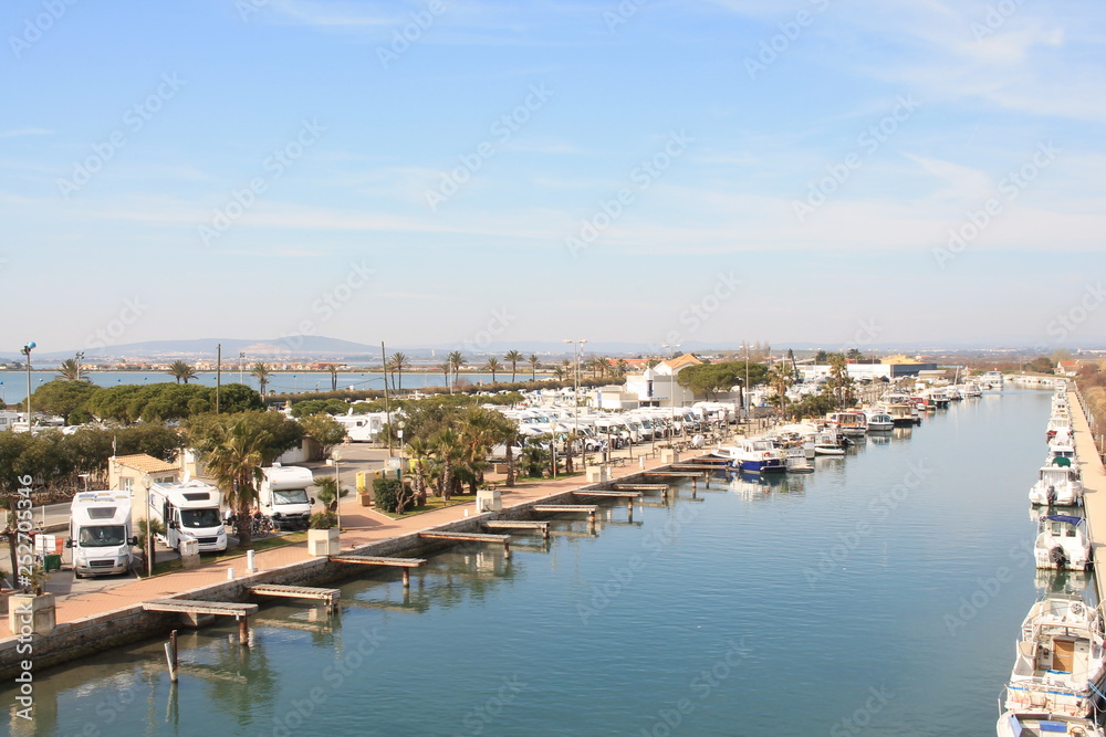 The Lez, a coastal river, and the motorhome area of in Palavas les flots, a seaside resort of the Languedoc coast in the south of Montpellier