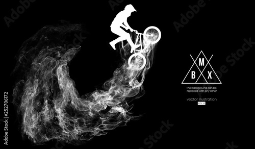 Abstract silhouette of a bmx rider on the dark, black background from particles, dust, smoke, steam. Bmx rider jumps and performs the trick. Background can be changed to any other. Vector illustration