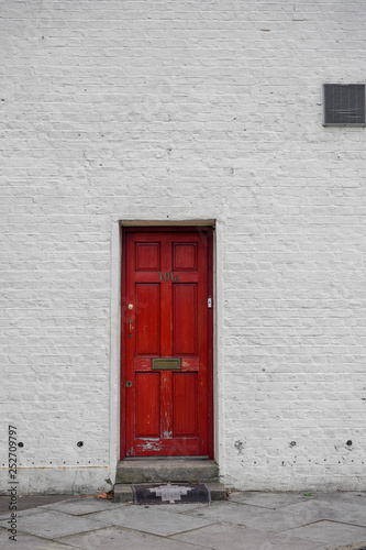door in red wall