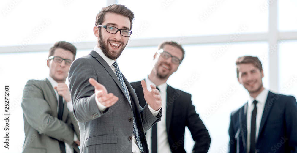 smiling businessman standing in the office smiling businessman standing in the office
