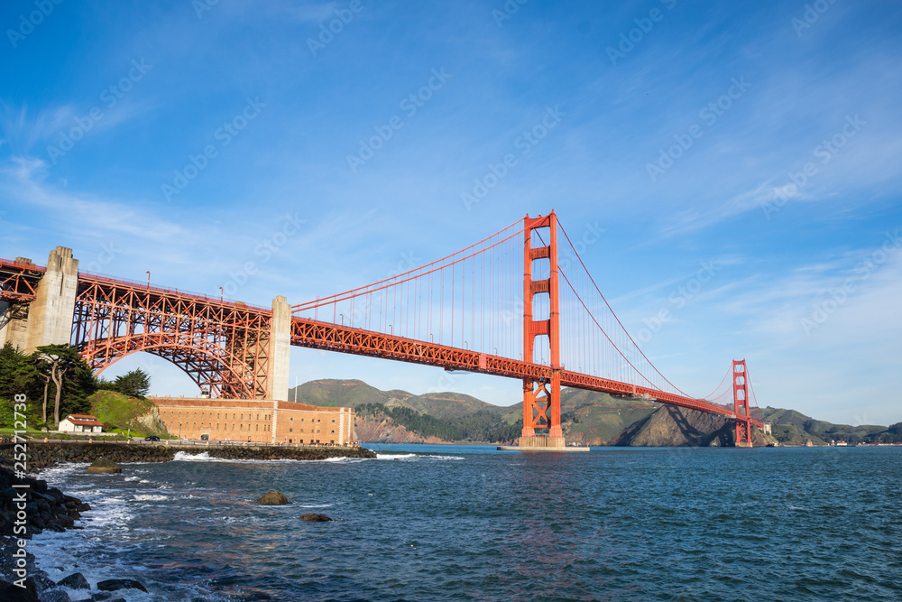 Surf in front of Golden Gate Bridge worldwide known symbol of California Surf in front of Golden Gate Bridge worldwide known symbol of California