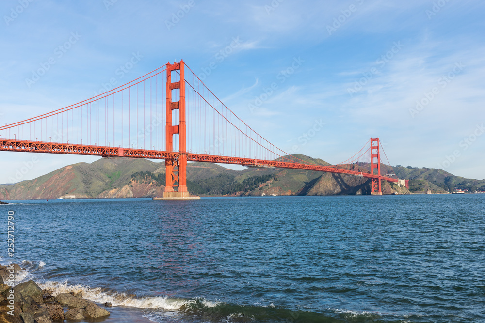 Surf in front of Golden Gate Bridge worldwide known symbol of California Surf in front of Golden Gate Bridge worldwide known symbol of California