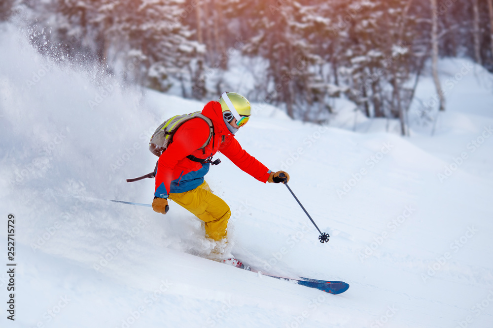 Man athlete mountain skiing rides on soft snow track in woods, chest action camera. Extreme concep Man athlete mountain skiing rides on soft snow track in woods, chest action camera. Extreme concep