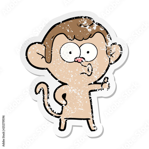 distressed sticker of a cartoon hooting monkey