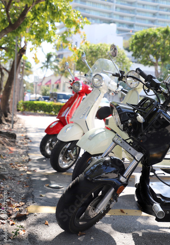 Canvas Print mopeds scooters parked in a row