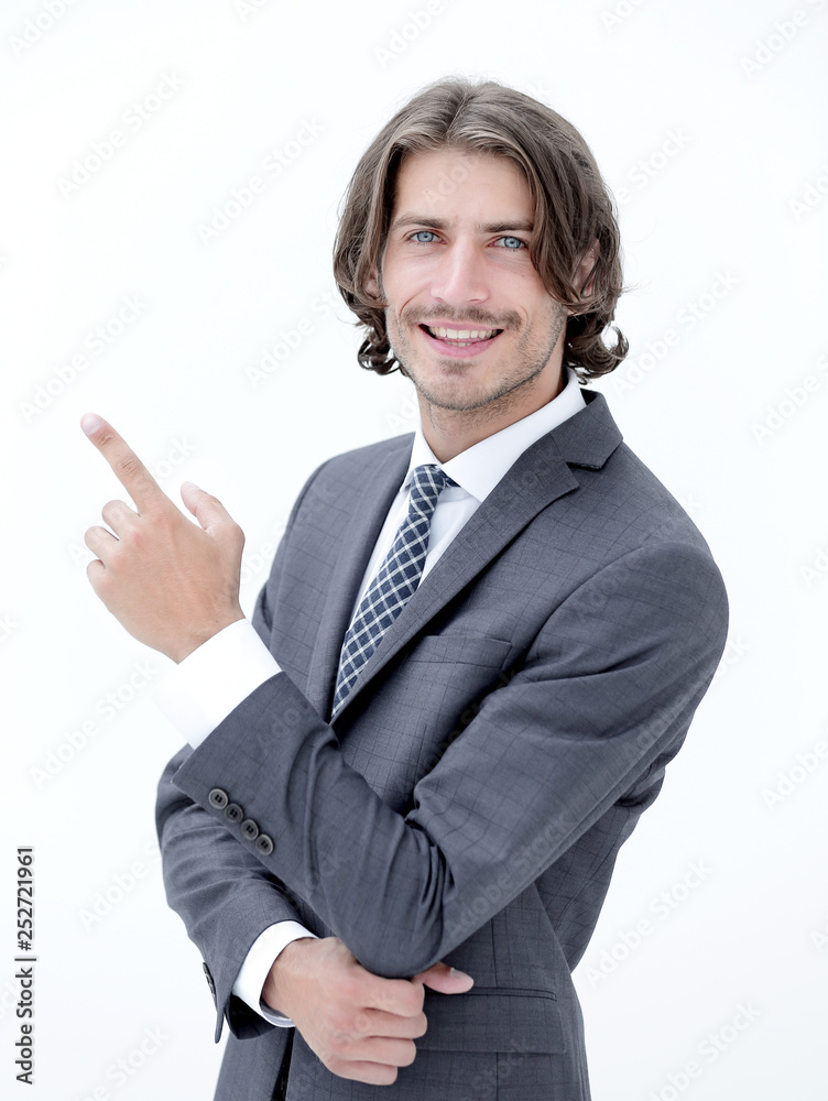 a young and handsome businessman pointing up with his finger a young and handsome businessman pointing up with his finger