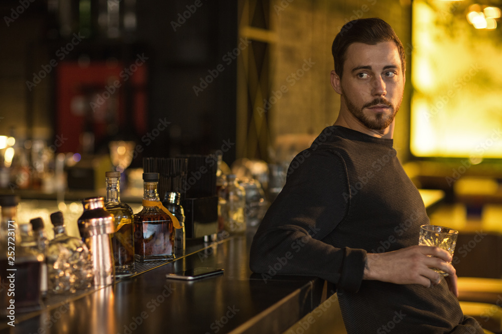 Handsome young man at the bar