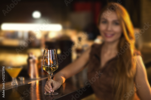 Young beautiful woman relaxing at the bar