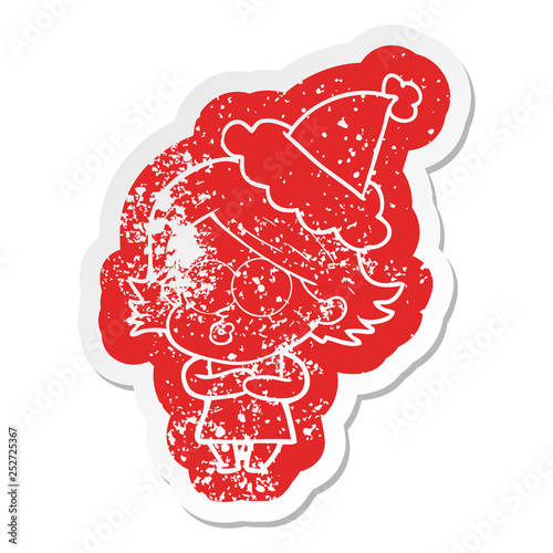 cartoon distressed sticker of a girl pouting wearing santa hat