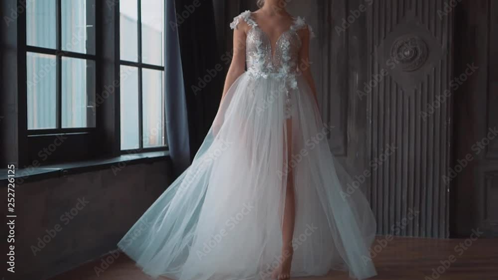 charming angel, new story about Cinderella and Snow White. attractive blond lady in long luxurious dress with open back and train posing for the camera and fun throws train and hem of dress up charming angel, new story about Cinderella and Snow White. attractive blond lady in long luxurious dress with open back and train posing for the camera and fun throws train and hem of dress up
