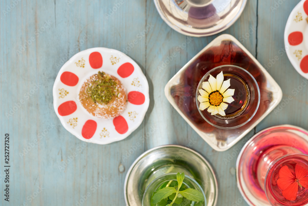 traditional Turkish red black tea tulip glass green flowers sweet dessert afternoon tea break