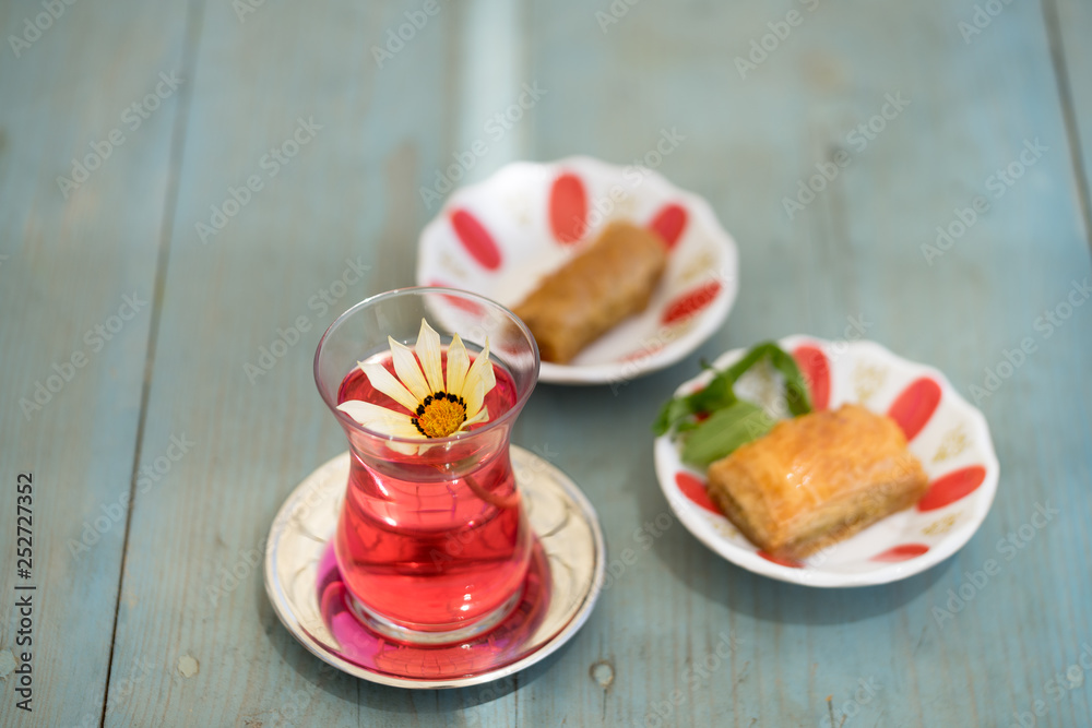 traditional Turkish red black tea tulip glass green flowers sweet dessert afternoon tea break