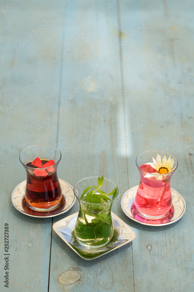 traditional Turkish red black tea tulip glass green flowers sweet dessert afternoon tea break