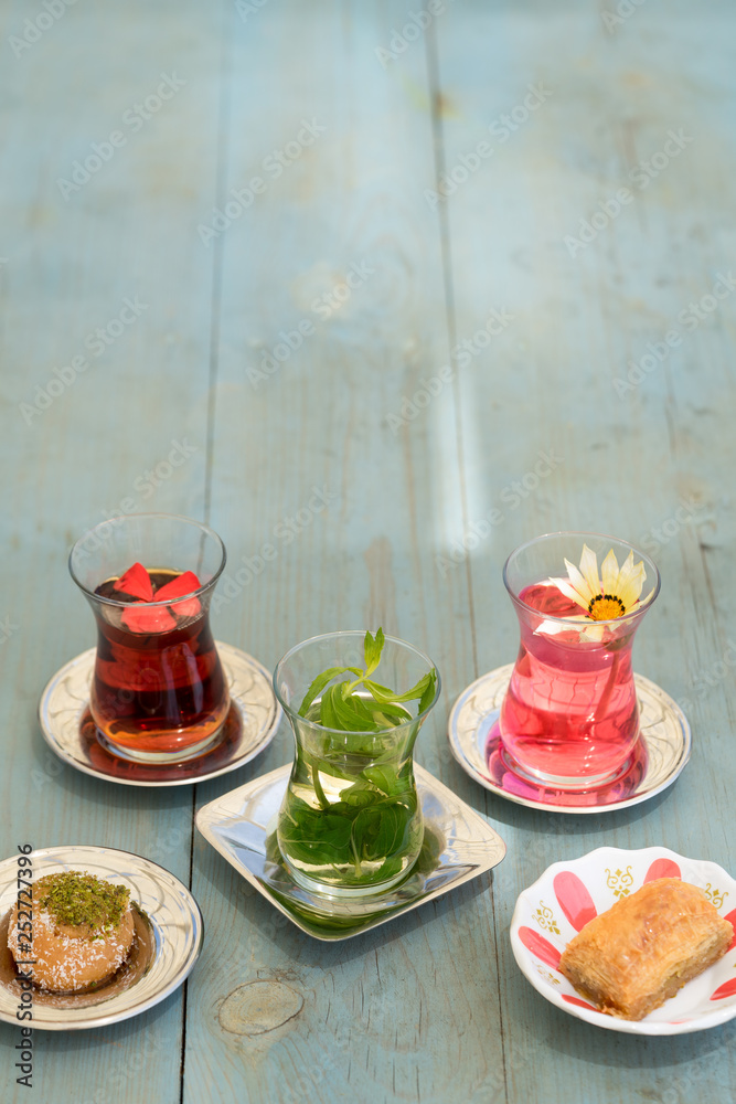 traditional Turkish red black tea tulip glass green flowers sweet dessert afternoon tea break