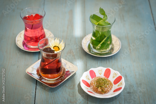 traditional Turkish red black tea tulip glass green flowers sweet dessert afternoon tea break